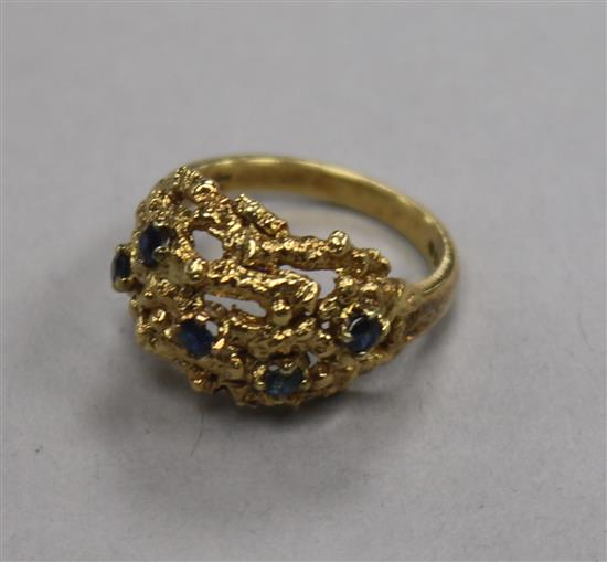 A 1960s 18ct gold and sapphire set pierced nugget ring, size M.